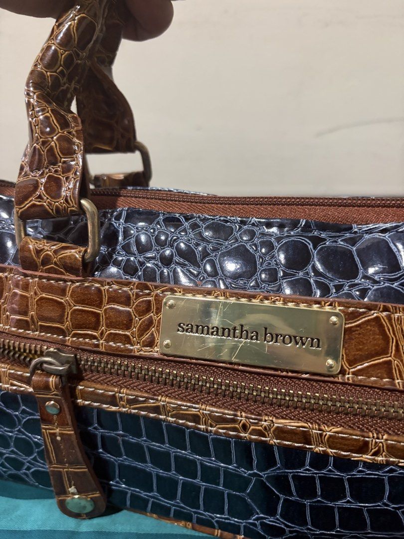 Samantha Brown Crocodile Pattern Bag (Category: Shoulder Bags) located in Las Pinas. Submitted by ces0427 (Listing ID 1461657249, Image 3). Description: - Stylish Samantha Brown bag - Unique crocodile pattern - Colorblock design: brown and dark blue sections - Textured brown handles - Silver interior lining - NO FLAW looks good as new - Secure all-around zip closure - Ideal for carrying your daily essentials.