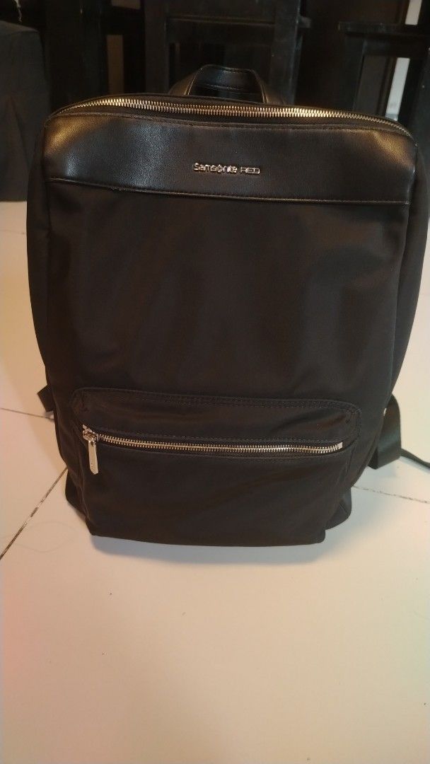 Samsonite RED Black Nylon Leather Backpack (Category: Backpacks) located in Manila. Submitted by wildwind_73f77a (Listing ID 1461562388, Image 1). Description: - Brand: Samsonite RED - Color: Black - Material: Nylon with leather accents - Features: Front zip pocket, main zip compartment - Condition: Clean interior, all zippers working well - Ideal for: Daily use, travel.