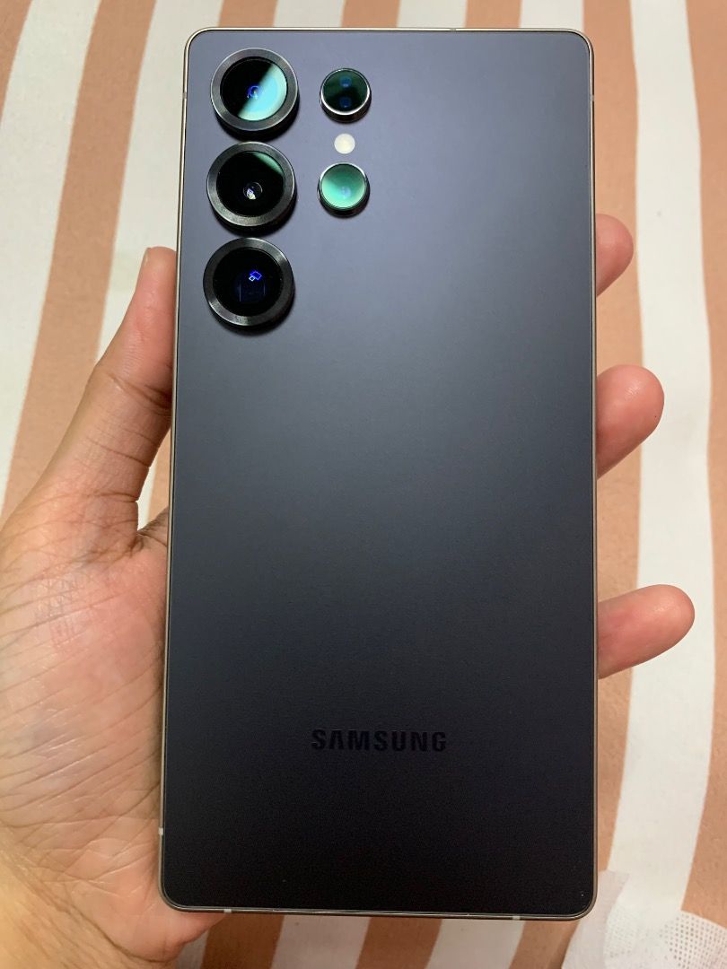 Samsung Galaxy S25 Ultra + AI Enabled Titanium Black 256GB (Category: Samsung) located in Caloocan City. Submitted by ccruz. (Listing ID 1461751908, Image 3). Description: Samsung Galaxy S25 Ultra + AI Enabled Titanium Black 256 gb Purchased on June 2026 Complete original inclusions + tempered glass + magsafe phone case can nego if sure buyer.