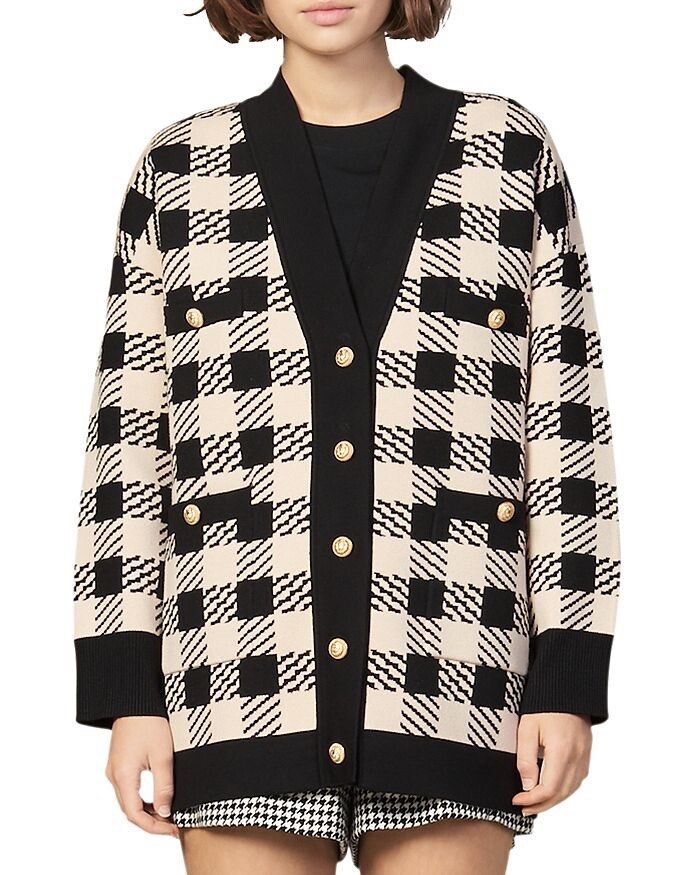 Sandro Paris Jisou Checked Knit Oversized Cardigan (Category: Coats, Jackets and Outerwear) located in Cebu City. Submitted by stylingtrends.coll (Listing ID 1461606194, Image 1). Description: - Classic checkered knit cardigan from Sandro - Mabigat super - Button-up front with elegant gold-tone buttons - functional front pockets - Contrasting black trim for a stylish look - Perfect for layering over various outfits Size: 2XL-3XL.