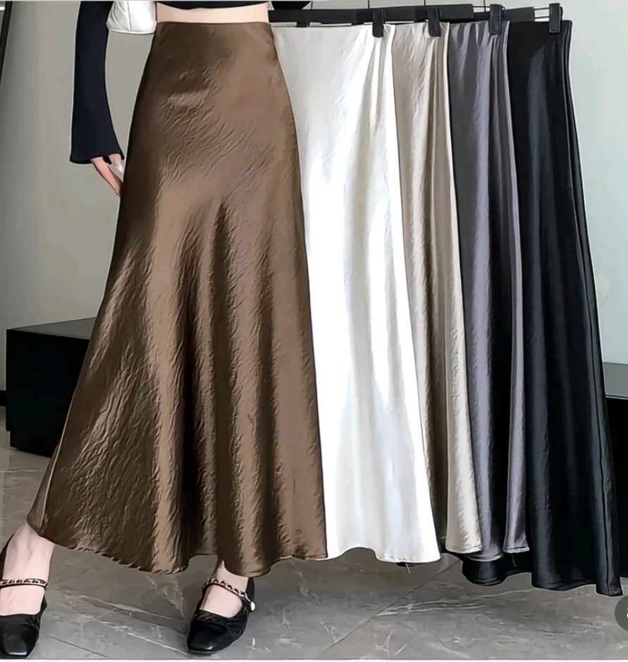 Satin Skirt BLACK 6XL (Category: Skirts) located in Makati City. Submitted by xealmadelin (Listing ID 1461671812, Image 1). Description: - Flowy satin slip skirt - Versatile: dress up or down - Available colors: brown, white, beige, grey, black - Fabric: nice sheen, slightly crinkled texture - Style: chic, minimalist - Features: comfortable elastic waistband.