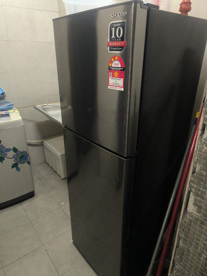 Sharp Refrigerator (Category: Refrigerators & Freezers) located in Kuala Lumpur. Submitted by llily886 (Listing ID 1461627608, Image 1). Description: - Sharp 2-door refrigerator (top freezer) - Color: Dark grey/black - Energy-saving mode - still under warranty - look new - Works well and keeps food fresh.
