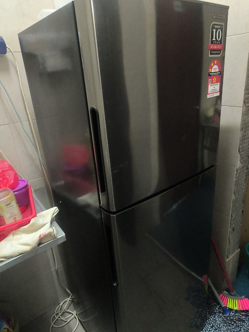 Sharp Refrigerator (Category: Refrigerators & Freezers) located in Kuala Lumpur. Submitted by llily886 (Listing ID 1461627608, Image 3). Description: - Sharp 2-door refrigerator (top freezer) - Color: Dark grey/black - Energy-saving mode - still under warranty - look new - Works well and keeps food fresh.