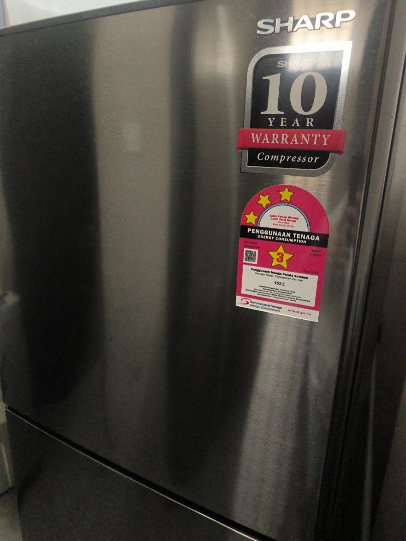 Sharp Refrigerator (Category: Refrigerators & Freezers) located in Kuala Lumpur. Submitted by llily886 (Listing ID 1461627608, Image 2). Description: - Sharp 2-door refrigerator (top freezer) - Color: Dark grey/black - Energy-saving mode - still under warranty - look new - Works well and keeps food fresh.