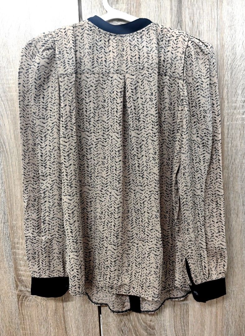 Sheer Printed Long Sleeve Blouse with Black Trim (Category: Blouses) located in Las Pinas. Submitted by offtonewhome (Listing ID 1461566406, Image 2). Description: - Lightweight sheer fabric - Subtle all-over print - Black collar and button placket - Long sleeves with black cuffs - Versatile for tucking into high-waisted bottoms or layering over a camisole.