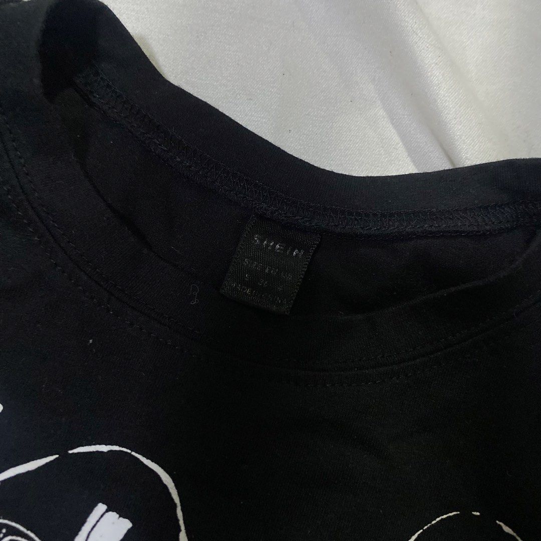 SHEIN Black Graphic Crop Top "Nice Vibe" (Category: Shirts) located in Rizal. Submitted by lili.s.choyce (Listing ID 1461722830, Image 3). Description: - Black crop top - Features 'Nice Vibe' graphic print with women and text - Short sleeves - Relaxed fit - Ideal for casual and trendy outfits.