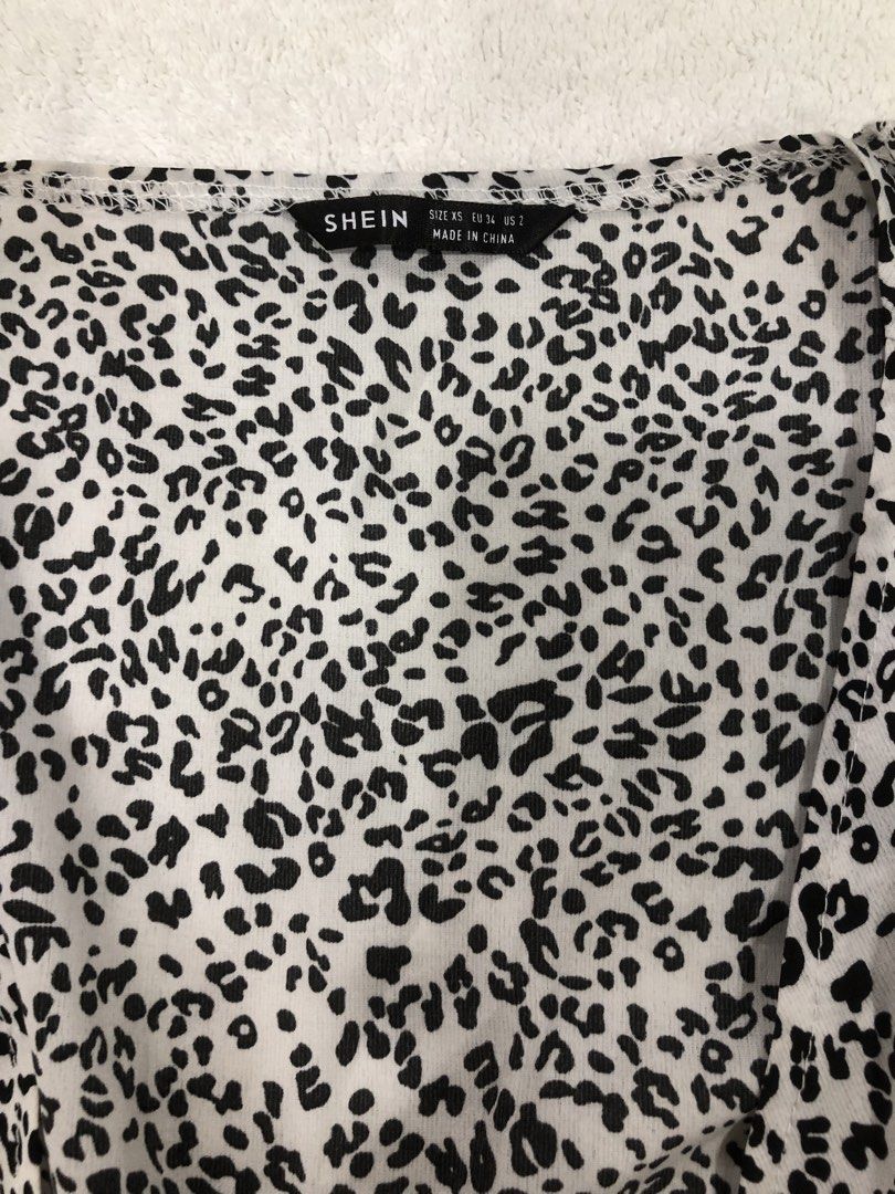 SHEIN Leopard Print Tie Front Top XS (Category: Sleeveless) located in Manila. Submitted by janmichael26601 (Listing ID 1461619720, Image 2). Description: - Shein top - Cool leopard print - Tie front detail - Lightweight and flowy fabric - Perfect for layering or wearing solo - Size XS.