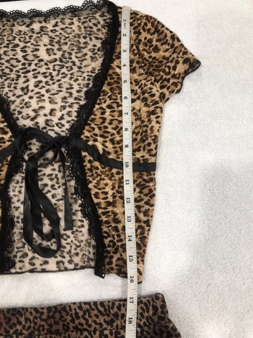 SHEIN Leopard Print Top and Skirt Set (Category: Sets or Coordinates) located in Manila. Submitted by janmichael26601 (Listing ID 1461615876, Image 3). Description: - Cute SHEIN leopard print top and skirt set - Top features short sleeves and a tie-front closure with lace trim - Skirt is mini length - Both items are size XXS - Ideal for a night out or a fun casual look - Measurements provided in photos.