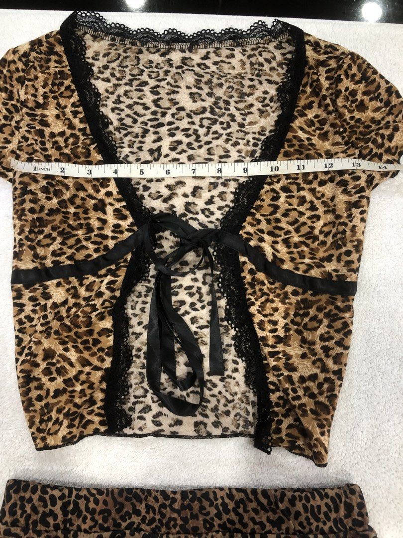 SHEIN Leopard Print Top and Skirt Set (Category: Sets or Coordinates) located in Manila. Submitted by janmichael26601 (Listing ID 1461615876, Image 2). Description: - Cute SHEIN leopard print top and skirt set - Top features short sleeves and a tie-front closure with lace trim - Skirt is mini length - Both items are size XXS - Ideal for a night out or a fun casual look - Measurements provided in photos.