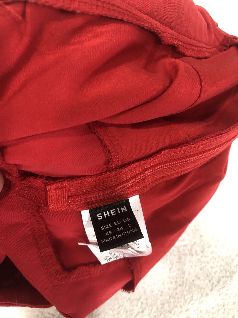 SHEIN Red Fringed Mini Skirt (Category: Skirts) located in Manila. Submitted by janmichael26601 (Listing ID 1461611150, Image 3). Description: - Red mini skirt from SHEIN - Features cute fringe detail on the side - Zipper closure for easy wear - Versatile for night outs or casual days - Pairs well with simple tops.