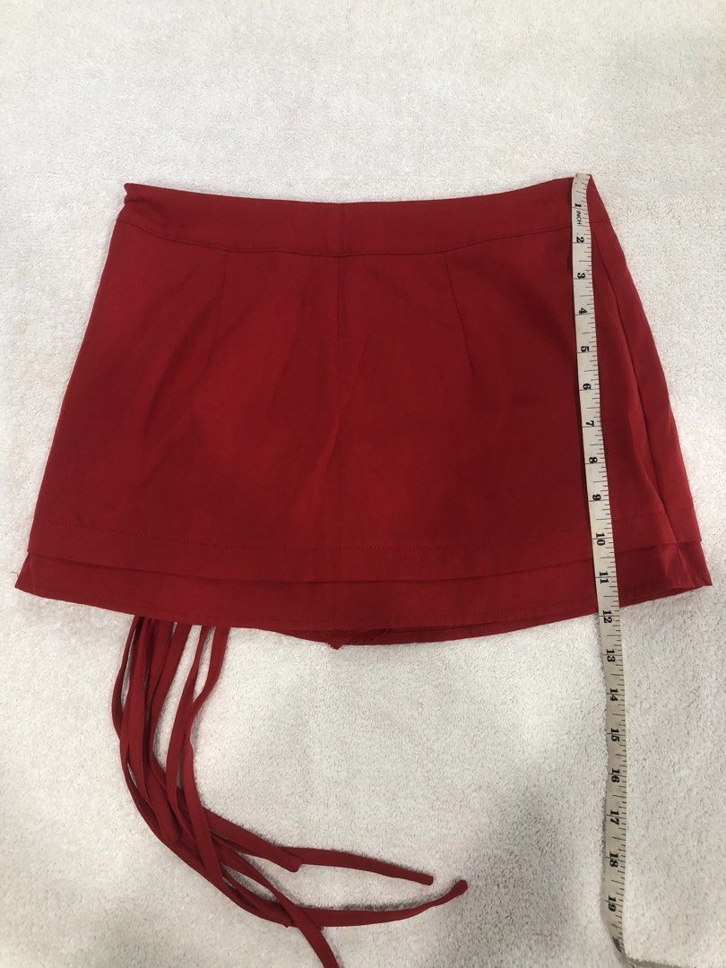 SHEIN Red Fringed Mini Skirt (Category: Skirts) located in Manila. Submitted by janmichael26601 (Listing ID 1461611150, Image 2). Description: - Red mini skirt from SHEIN - Features cute fringe detail on the side - Zipper closure for easy wear - Versatile for night outs or casual days - Pairs well with simple tops.