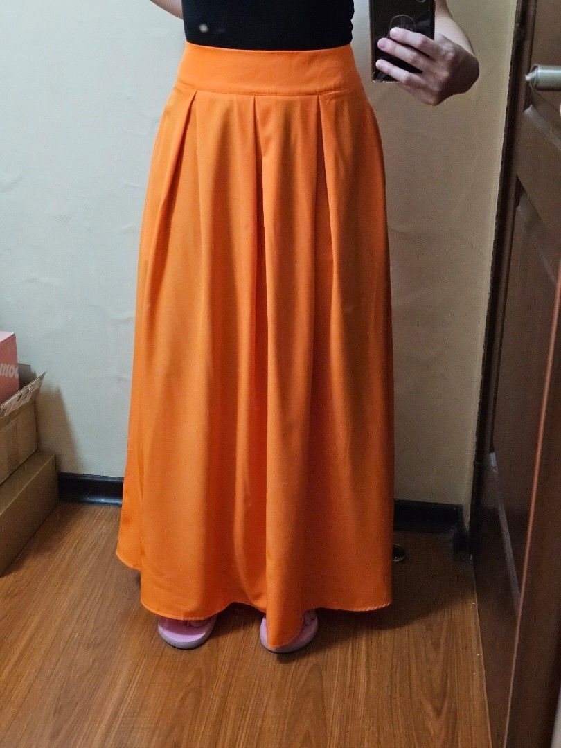 Shein skirt orange (Category: Skirts) located in Manila. Submitted by chocomoose (Listing ID 1461603726, Image 2). Description: long skirt will fit XS to S bnew.