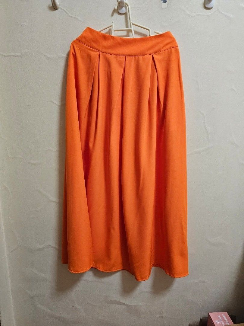 Shein skirt orange (Category: Skirts) located in Manila. Submitted by chocomoose (Listing ID 1461603726, Image 1). Description: long skirt will fit XS to S bnew.