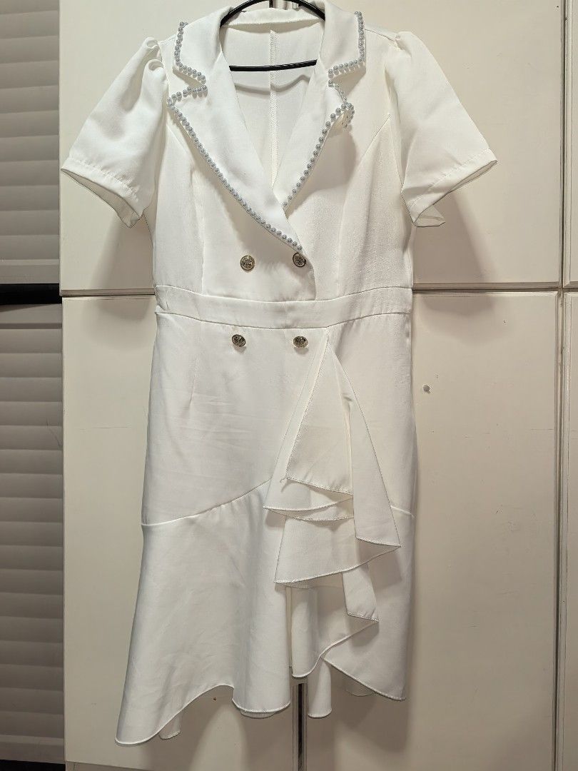 SHEIN White Summer Elegant Work Blazer Dress (Category: Dresses) located in Cabanatuan. Submitted by saffy17 (Listing ID 1461588426, Image 2). Description: - White blazer dress - Size: Large - Condition: Worn only once - Features: Pearl details on collar and buttons, ruffled hem skirt - Ideal for: Events or work .
