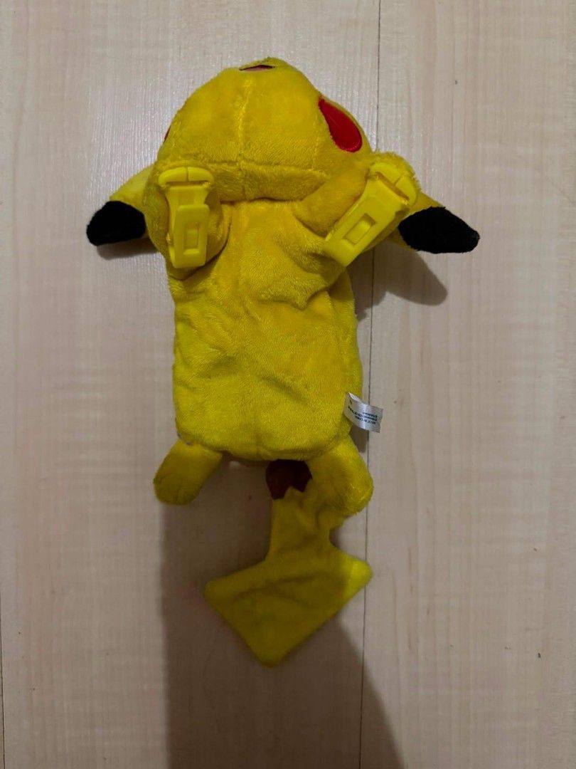 Sleeping / Lying Down Pikachu Plush Strap Cover Holder (will be extra cleaned for ur sake) (Category: Character Goods) located in Quezon City. Submitted by chennister (Listing ID 1461735035, Image 2). Description: Authentic Pokémon Sleeping Pikachu plush pouch/holder featuring a cute lying-down pose with sleeping embroidered eyes. Equipped with adjustable yellow clips on the underside to attach securely onto bag straps, backpacks, or seatbelts. I