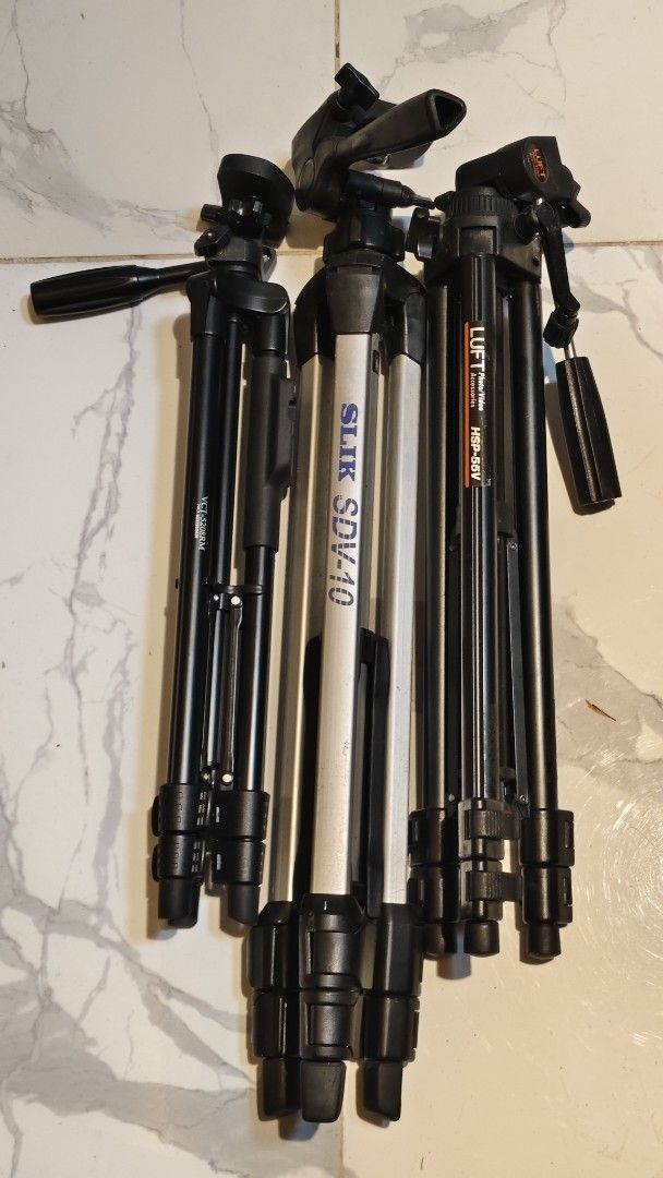 Slik, Luft, VCT Tripods - Bundle Deal (Category: Tripods & Monopods) located in Bulacan. Submitted by babz30261 (Listing ID 1461656298, Image 1). Description: - Bundle of 3 tripods: Slik SDV-10, Luft HSP-55V, and VCT-528RM. - All tripods are functional and ready for immediate use. - Perfect for both photography and videography needs. - Great value when purchased as a set..