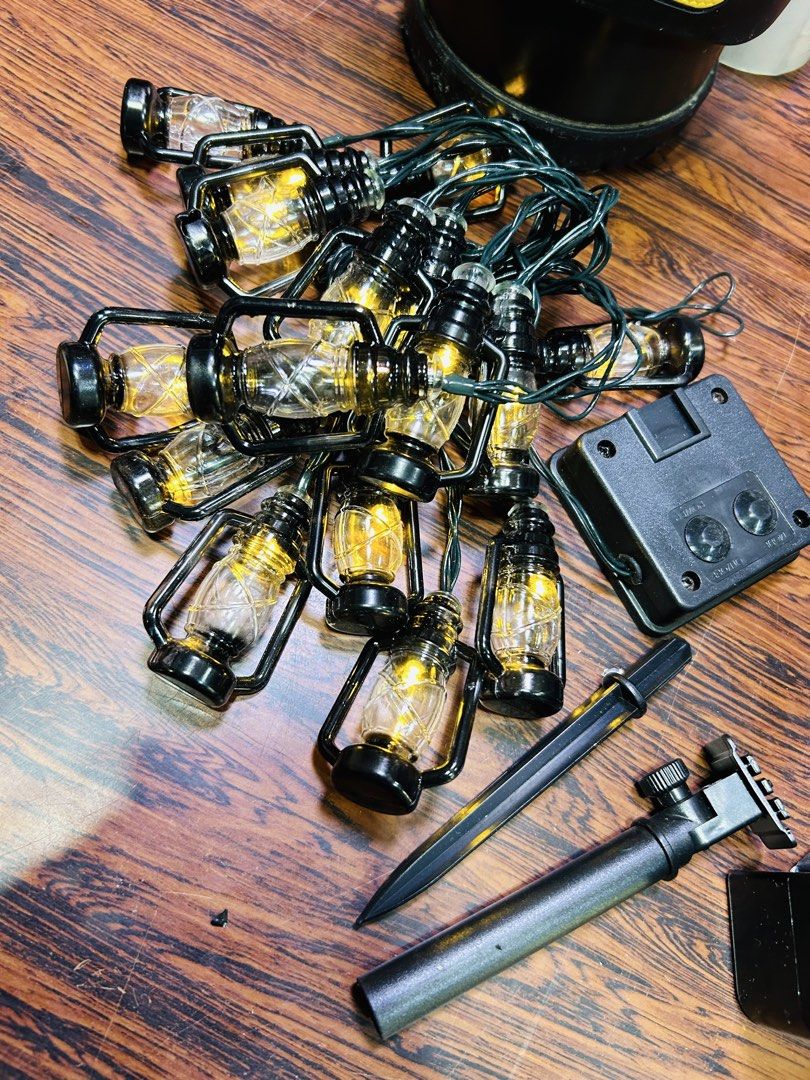 Solar Powered Lantern String Lights for Outdoor Decor (Category: Lighting) located in Manila. Submitted by starbalesukandjapansurplus (Listing ID 1461624054, Image 1). Description: - Solar-powered string lights with charming mini lantern bulbs. - Ideal for decorating patios, gardens, and outdoor spaces. - Charges automatically during the day and illuminates at night. - Easy installation with the included ground stake. - Creates a warm and cozy at