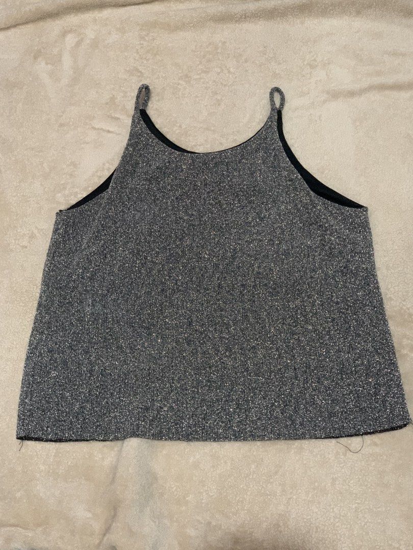 Sparkly Silver Cami Top with Spaghetti Straps (Category: Sleeveless) located in Davao. Submitted by la__laura (Listing ID 1461773475, Image 1). Description: - Cute sparkly silver cami top - Features thin spaghetti straps - Fabric has a nice shimmer - Ideal for layering or wearing on its own - Pairs well with jeans or a skirt - Easy to dress up or down.