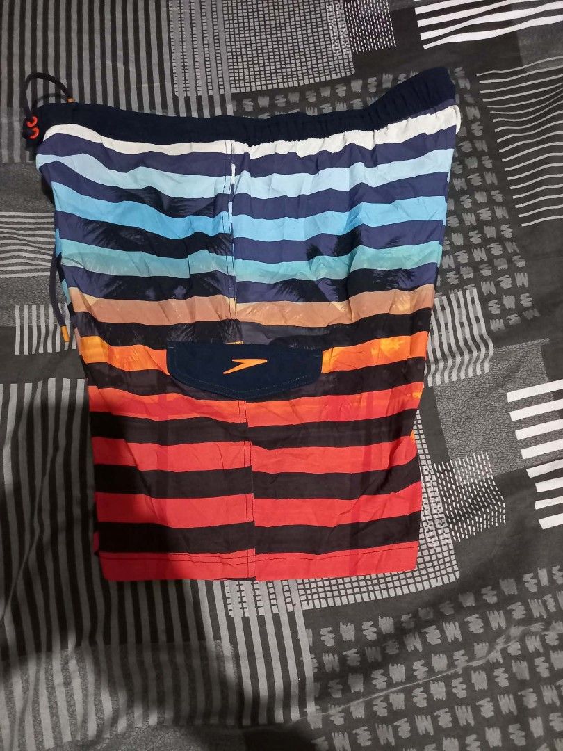 Speedo Striped Swim Trunks L/G (Category: Swim Trunks & Board Shorts) located in Panabo. Submitted by khimmyirish_ki021126 (Listing ID 1461681533, Image 2). Description: - Speedo Swim Trunks - Size: L/G - Design: Colorful horizontal stripes - Features: Elastic waistband with drawstring, back velcro pocket - Origin: Made in Vietnam - Ideal for: Swimming or poolside lounging.