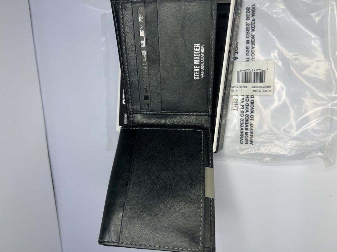Steve Madden Black Genuine Leather RFID Blocking Bifold Wallet (Category: Wallets & Card Holders) located in Quezon City. Submitted by gigisantos (Listing ID 1461605475, Image 2). Description: - Brand: Steve Madden - Color: Black - Material: 100% Genuine Leather - Features: RFID Blocking Technology, Multiple Card Slots, Bill Compartment - Condition: Brand New (in original packaging) 100% original from USA/Canada Brand new Moneyback guarantee if p