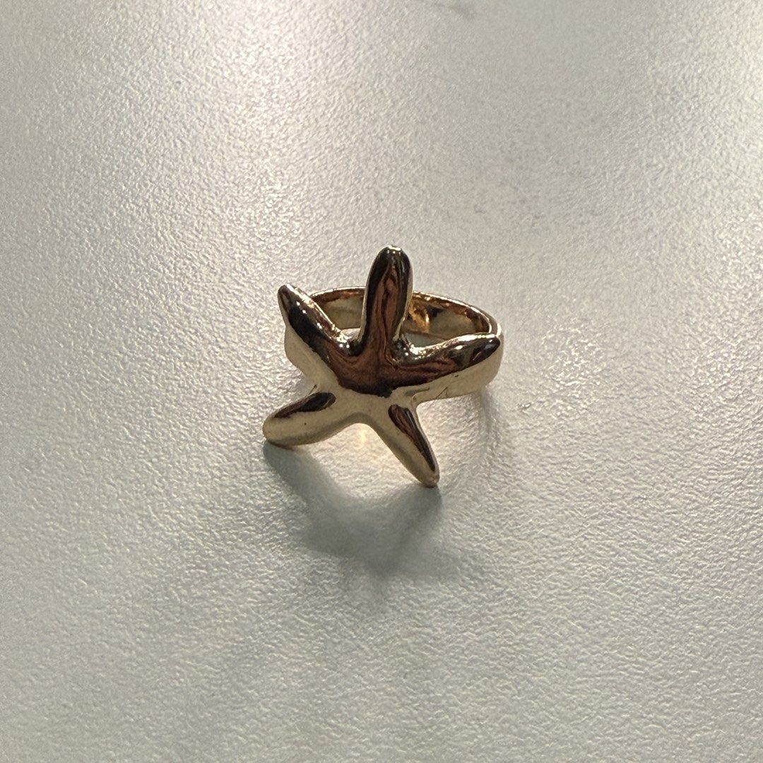 Stradivarius Gold Starfish Ring (Category: Rings) located in Pateros City. Submitted by sachiereyes (Listing ID 1461763219, Image 2). Description: - Never been used - Gold tone finish - Approximately 2cm in diameter - Unique and fun design - Perfect for beach lovers and sea-themed accessory fans.