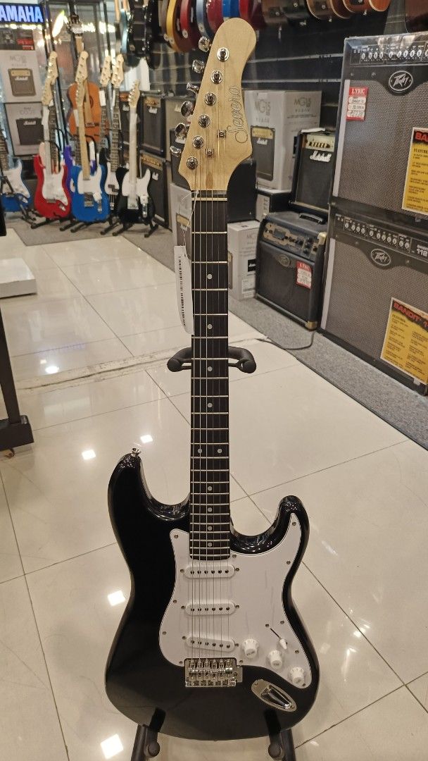 Stratocaster Severo Electric Guitar with Marshall MG15 Amplifier (Category: Musical Instruments) located in Manila. Submitted by johnoah213 (Listing ID 1461656532, Image 3). Description: - Black body electric guitar - White pickguard - Includes Marshall MG15 amplifier - Ideal starter pack for aspiring musicians.