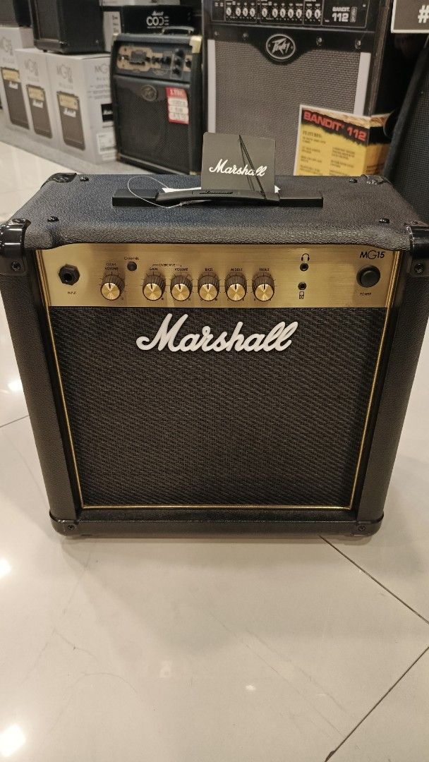 Stratocaster Severo Electric Guitar with Marshall MG15 Amplifier (Category: Musical Instruments) located in Manila. Submitted by johnoah213 (Listing ID 1461656532, Image 2). Description: - Black body electric guitar - White pickguard - Includes Marshall MG15 amplifier - Ideal starter pack for aspiring musicians.
