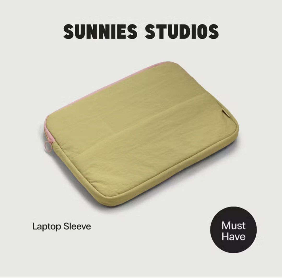 Sunnies Studios Lightweight Puffy Laptop Sleeve (Category: Laptop Bags & Sleeves) located in Dumangas. Submitted by tincajipo16 (Listing ID 1461577341, Image 1). Description: - Lightweight puffy laptop sleeve by Sunnies Studios - Made from durable nylon - Fits most 13", 14", and 15" laptops - Features a waterproof zipper for extra protection - Includes an elastic strap for convenient carrying - Available in Taffy, Durian, and Blackberry - Dimensi