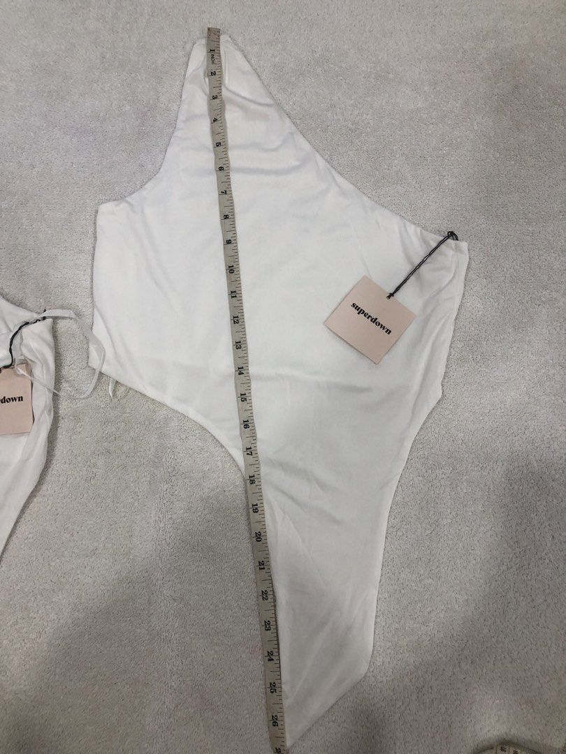 Superdown White One Shoulder Bodysuit XS (Category: Others Tops) located in Manila. Submitted by janmichael26601 (Listing ID 1461610073, Image 2). Description: - Superdown white one-shoulder bodysuit - Size XS - Features adjustable straps - Versatile: great for layering or wearing on its own - Comfortable and stylish design.