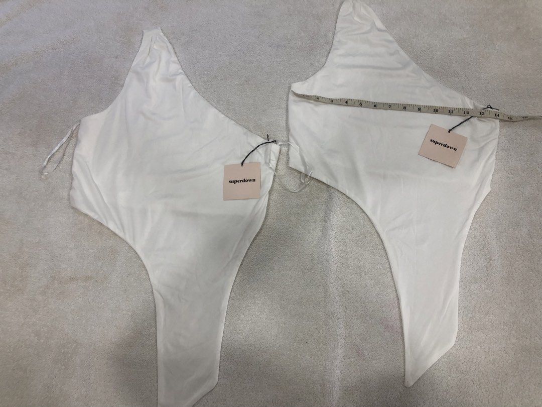 Superdown White One Shoulder Bodysuit XS (Category: Others Tops) located in Manila. Submitted by janmichael26601 (Listing ID 1461610073, Image 1). Description: - Superdown white one-shoulder bodysuit - Size XS - Features adjustable straps - Versatile: great for layering or wearing on its own - Comfortable and stylish design.