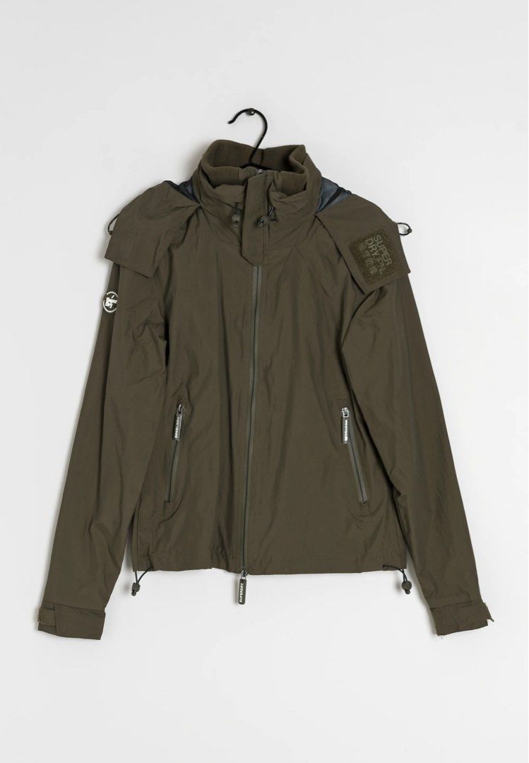 Superdry hooded windcheater Jacket (Category: Coats, Jackets and Outerwear) located in Quezon City. Submitted by mancave_stuff (Listing ID 1461647820, Image 1). Description: - Superdry Jacket - Color: Olive Green - Size: Large (W22” x L29”) - Features: Hood, multiple zip pockets - Adjustable hem with drawstrings - Ideal for outdoor activities and casual wear - Excellent condition. No issue.