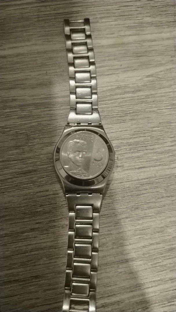 Swatch Watch Silver Metal Strap (Category: Women's Watches) located in Manila. Submitted by wildwind_73f77a (Listing ID 1461586634, Image 2). Description: - Genuine silver Swatch watch - Clean, minimalist watch face with silver markers - Classic metal link bracelet - Durable and stylish for everyday wear - Features Swatch logo and text on the back.