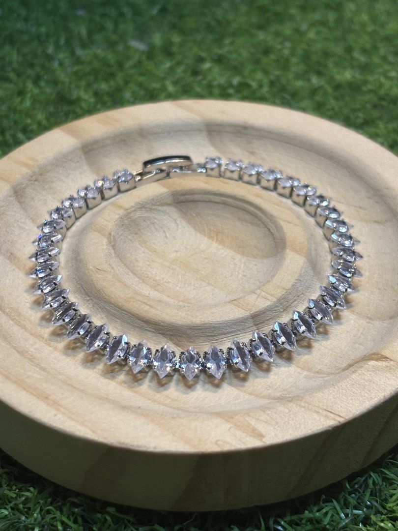 Tennis bracelet silver tone with stone (Category: Bracelets) located in Davao. Submitted by ememlou17 (Listing ID 1461749848, Image 1). Description: Tennis bracelet size 7-7.5inches Rhodium/platinum plated over copper setting #japanjewelries #japansurplus #japanuk.