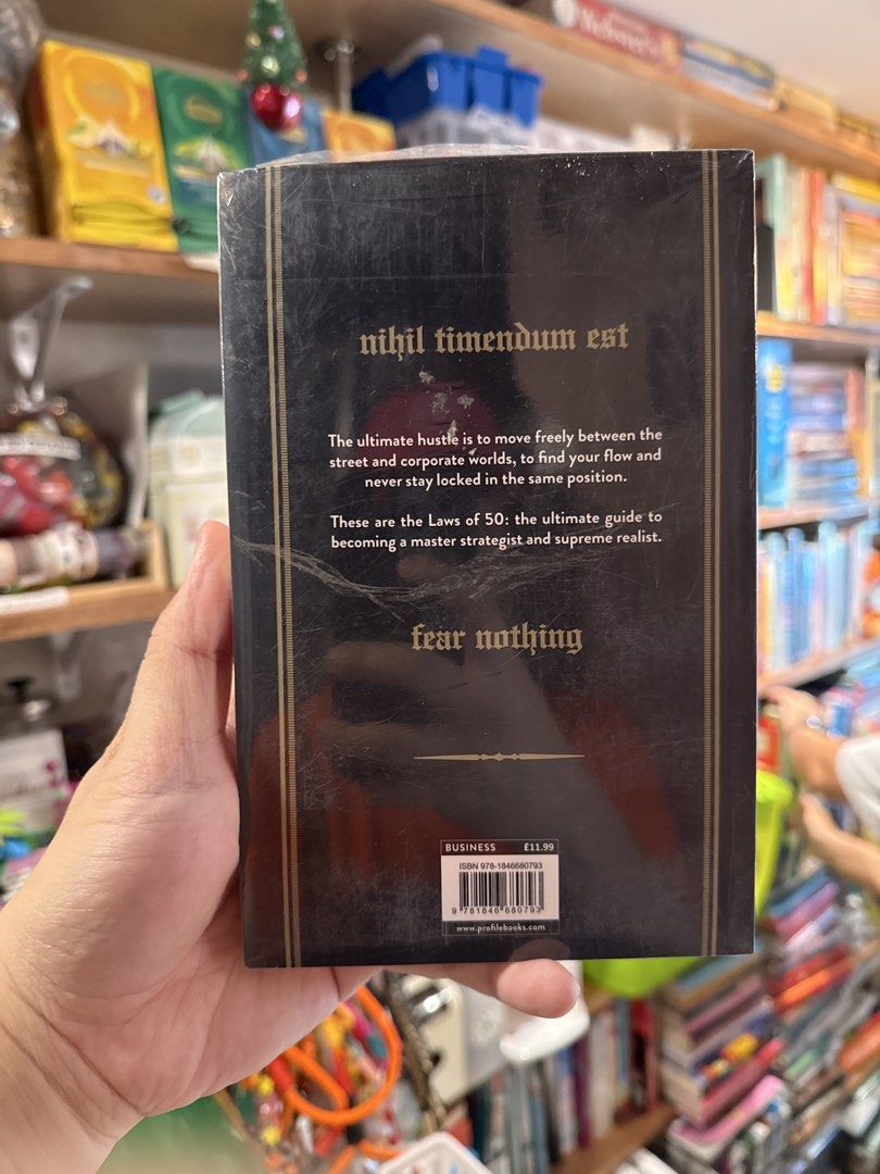 The 50th Law by 50 Cent and Robert Greene (Category: Storybooks) located in Marikina City. Submitted by starlettonabudget (Listing ID 1461657935, Image 2). Description: - 'The 50th Law' by 50 Cent & Robert Greene - Dubbed 'The hip hop entrepreneur book' - Features the motto 'nihil timendum est' (fear nothing) - A guide to becoming a master strategist and supreme realist - Excellent for business and personal growth.