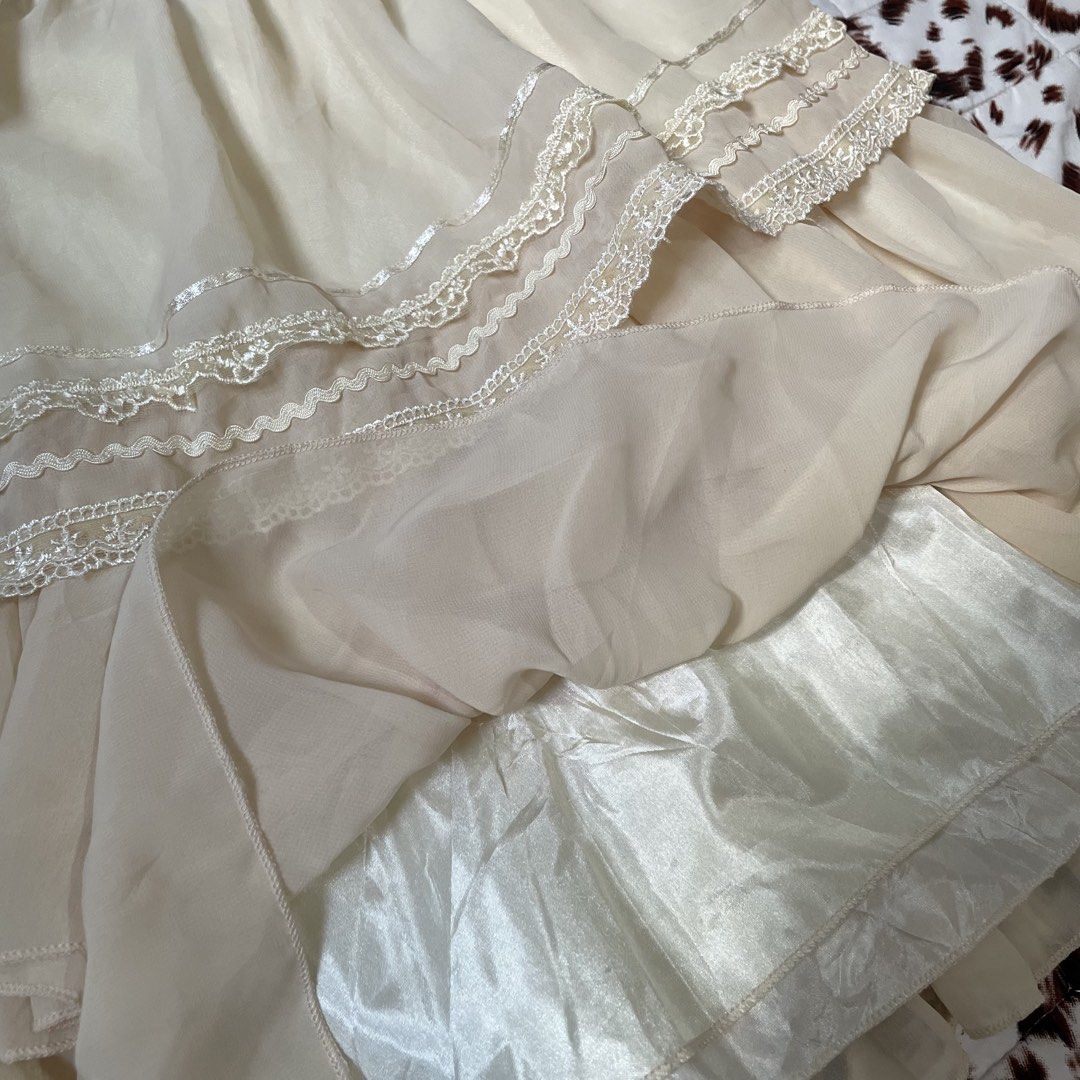 Tiered Ruffle Lace Trimmed Skirt (Category: Skirts) located in Manila. Submitted by bamz.col (Listing ID 1461708417, Image 2). Description: 𝜗𝜚˚⋆ Cream layered skirt • waist line: 26-30in • washed (ready to wear) • flaws: none • condition: 10/10 𐙚˚࿔ no to joy miners | no deleting comments | no cancellations | don’t mine if you cannot pay on time. mop: gcash mod: J&T.