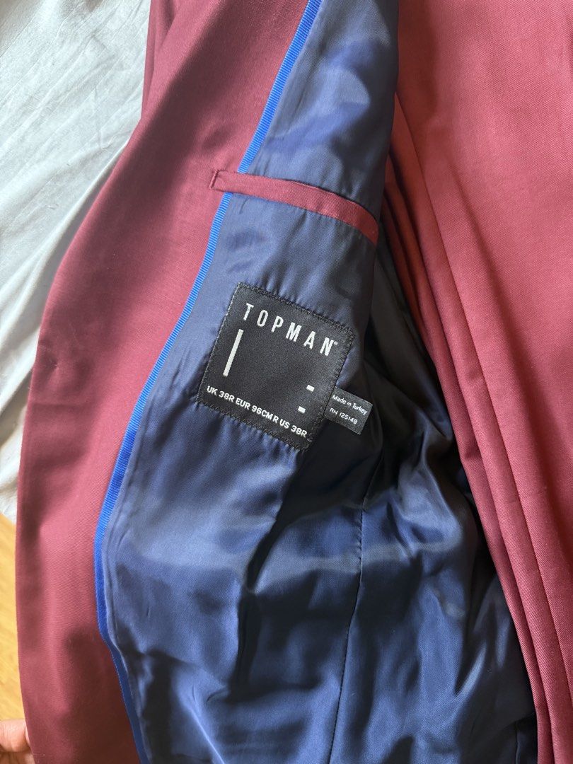 Men’s Coat (Category: Coats, Jackets and Outerwear) located in Mandaluyong City. Submitted by jamesy006 (Listing ID 1461591317, Image 2). Description: - Topman Burgundy Suit Set - Jacket Size: UK 38R - Trousers Size: UK 30S - Navy blue lining with blue trim details - Versatile for formal events or smart casual wear - Selling as a complete set.