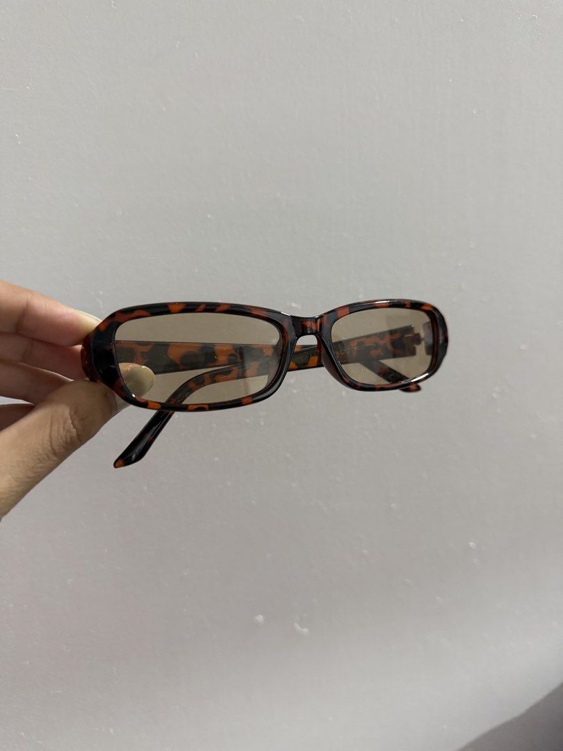 Tortoiseshell Rectangle Sunglasses (Category: Sunglasses & Eyewear) located in Pasig City. Submitted by miss_abuelita (Listing ID 1461692447, Image 1). Description: - Retro style tortoiseshell sunglasses - Rectangular frames - Tinted lenses - Lightweight and comfortable - Perfect for sunny days.