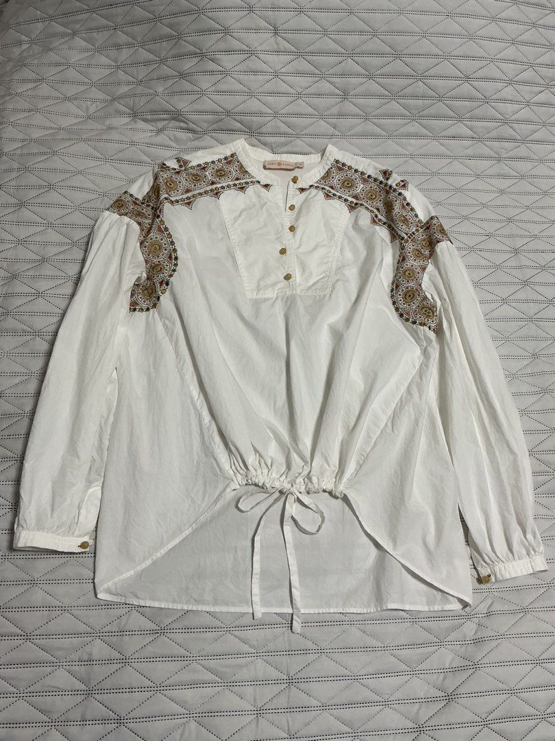 TORY BURCH (Category: Blouses) located in Makati City. Submitted by boldturtle-8720 (Listing ID 1461711506, Image 2). Description: White TORY BURCH oversize top with colorful embroidered shoulder panels and a tie-front hem. Fits XS to L.