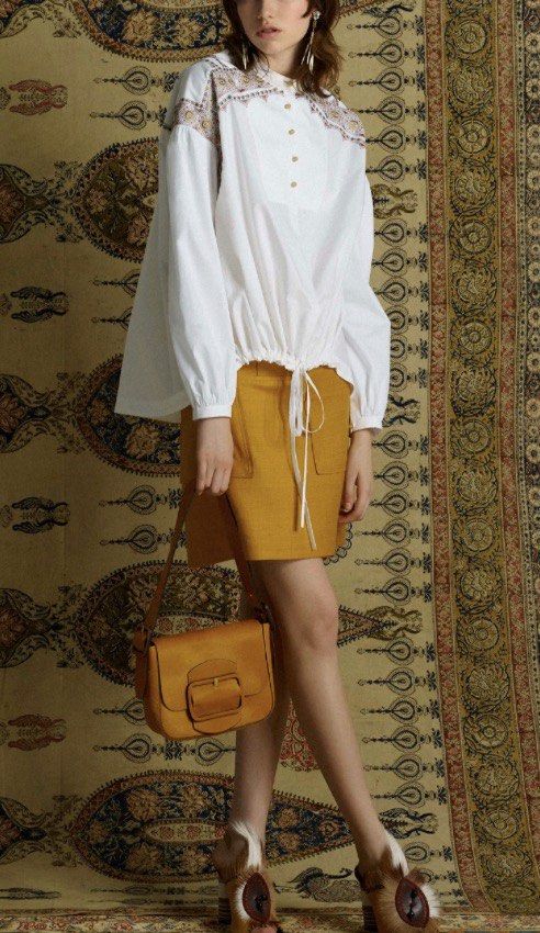 TORY BURCH (Category: Blouses) located in Makati City. Submitted by boldturtle-8720 (Listing ID 1461711506, Image 1). Description: White TORY BURCH oversize top with colorful embroidered shoulder panels and a tie-front hem. Fits XS to L.
