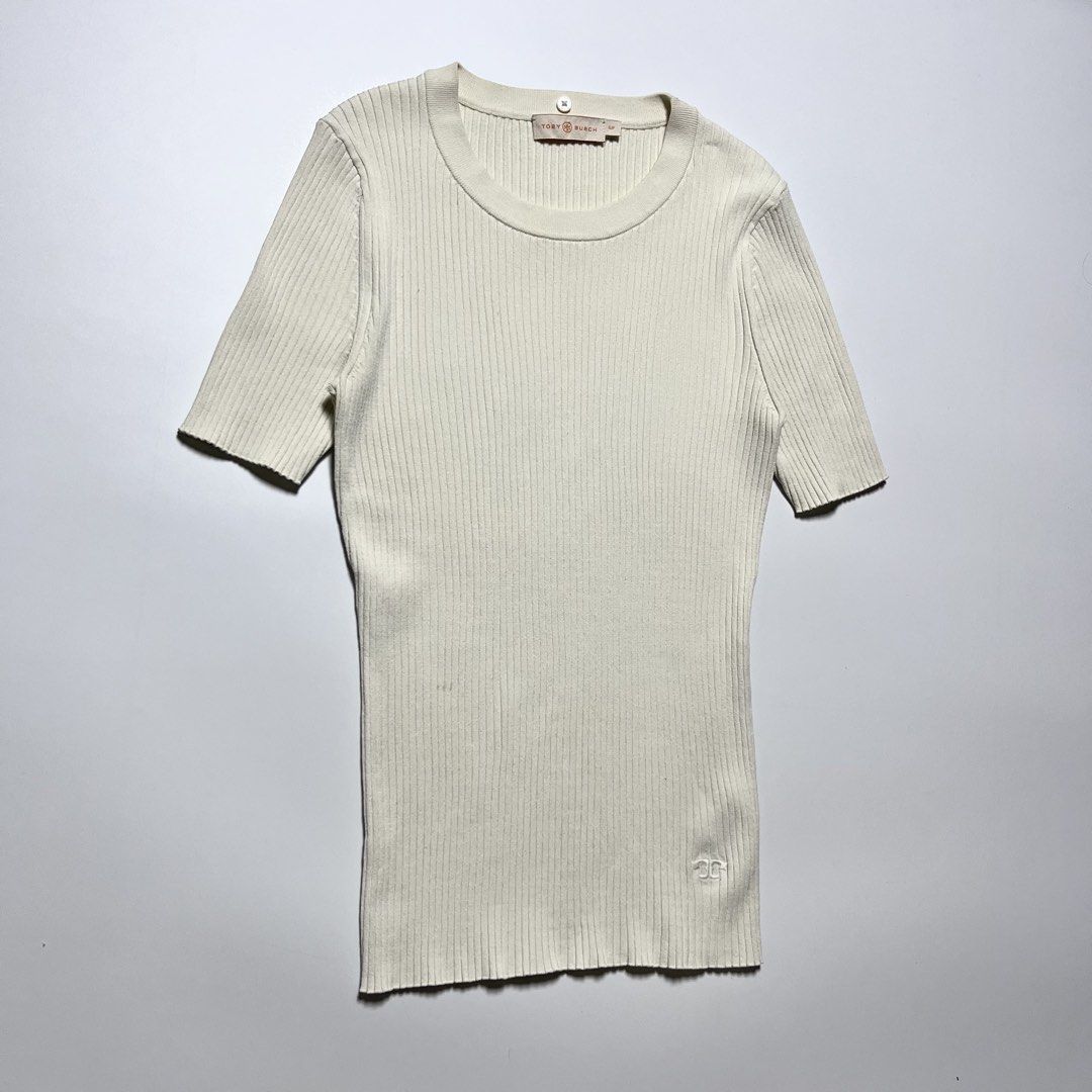 Tory Burch ribbed short-sleeve knit top (Category: Shirts) located in Cebu City. Submitted by franceuy (Listing ID 1461612585, Image 2). Description: Excellent Condition Issue: Stain (check last photo) need clean/wash only. W-12.5 L-23 Color rate: 9/10 Cebu City📍.