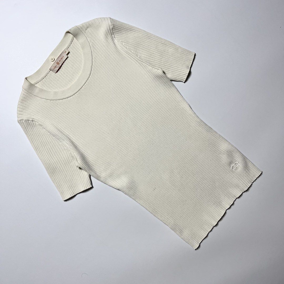 Tory Burch ribbed short-sleeve knit top (Category: Shirts) located in Cebu City. Submitted by franceuy (Listing ID 1461612585, Image 3). Description: Excellent Condition Issue: Stain (check last photo) need clean/wash only. W-12.5 L-23 Color rate: 9/10 Cebu City📍.