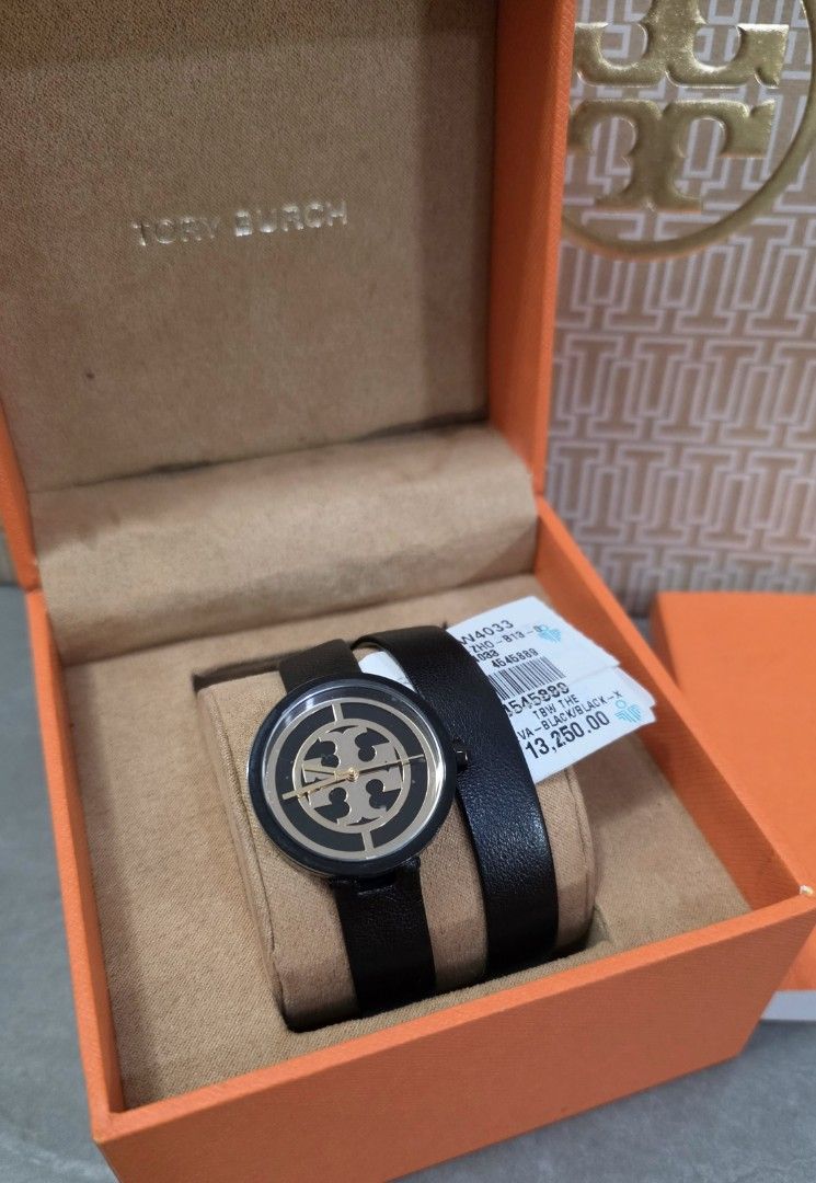 Tory Burch Watch (Brand New) (Category: Luxury Watches) located in Mandaluyong City. Submitted by ae.niceguy (Listing ID 1461785129, Image 2). Description: Tory Burch Watch TBW4033 (Brand New) Complete Unit, Box, Papers, Tag and Paper Bag Style: Reva Double Wrap Leather Size: 28MM Color: Black/Gold Material: Genuine Leather Strap SKU: TBW4033 Original Price: Php 13,250 Selling: Php 5,300- 60% OFF.