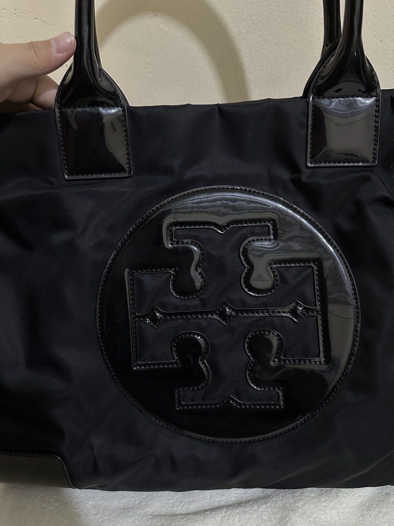 Tory Burch Ella (Category: Tote Bags) located in Las Pinas. Submitted by bagsbyshai (Listing ID 1461714589, Image 2). Description: Original/Authentic Nylon, Patent and Canvas (inside) combination Pristine Condition just wash the canvas inside No Flaws Magnetic Closure Puller still with cover Tory logo still with plastic Made in China.