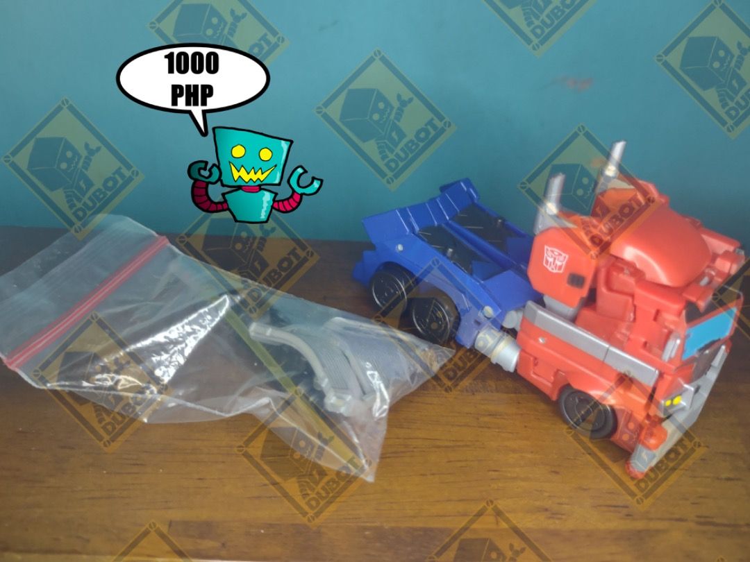 TRANSFORMERS CYBERVERSE ADVENTURES DELUXE OPTIMUS PRIME (Category: Action & Battle Toys) located in Navotas City. Submitted by christianmarkvidallo (Listing ID 1461765766, Image 2). Description: TRANSFORMERS CYBERVERSE ADVENTURES DEUXE OPTIMUS PRIME In very good condition No BAF/Weapon No Energy Blast Effect Free Energy Rifle Free Energy Sword and Shield 1000 php Item Location: Project 8, Quezon City Payment Options: Gcash/ BDO Deposit Shipping O