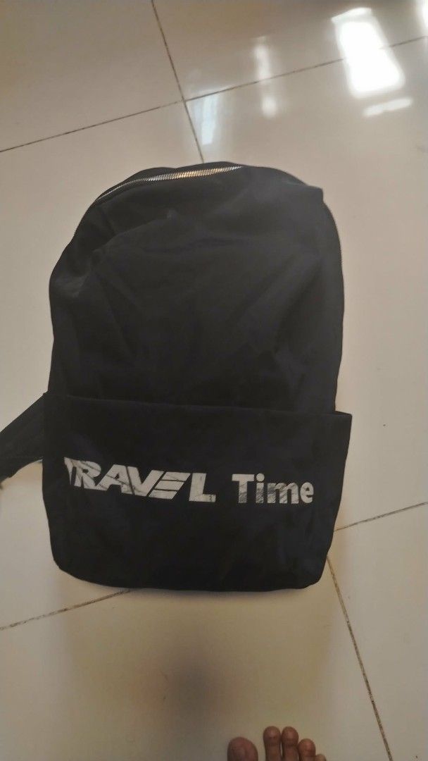 Travel Time Black Backpack (Category: Backpacks) located in Manila. Submitted by wildwind_73f77a (Listing ID 1461586506, Image 1). Description: - Black backpack with 'TRAVEL Time' logo - Main compartment with zippered closure and internal divider pocket - Front zippered pocket for easy access - Adjustable straps for a comfortable fit - Ideal for everyday use and short trips.