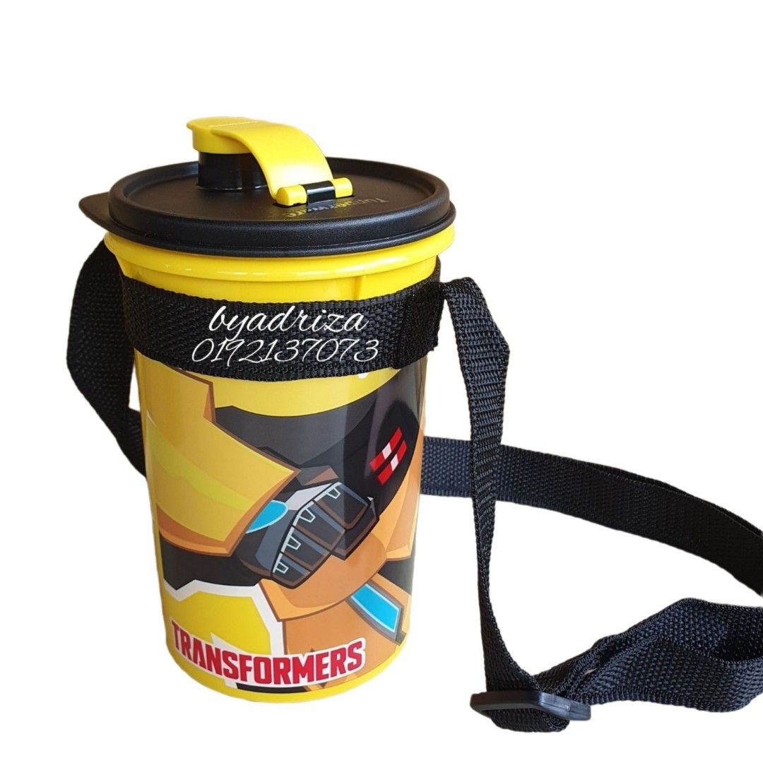 Tupperware Transformers (Category: Water Bottles & Tumblers) located in Shah Alam. Submitted by byadriza (Listing ID 1461797180, Image 3). Description: - Awesome Tupperware tumbler featuring Bumblebee from Transformers. - Large 1 liter capacity. - Comes with a convenient strap for easy carrying. - Ideal for kids or any Transformers enthusiast. - Perfect for school, sports, or everyday hydration needs. - Durable and features a fun, eye-catching de