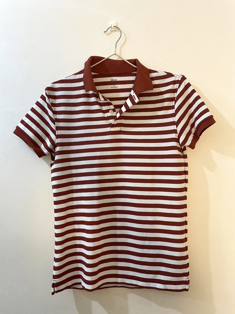 Uniqlo Polo (Unisex) (Category: Tshirts & Polo Shirts ) located in Pasig City. Submitted by baldgal_sells (Listing ID 1461686287, Image 1). Description: - Brand: Uniqlo - Type: Unisex Polo Shirt - Design: Dark orange and white stripes - Condition: well-used, pre-loved, minor issues, still in good condition - Style: Versatile for casual or smart-casual wear DM for more pics.