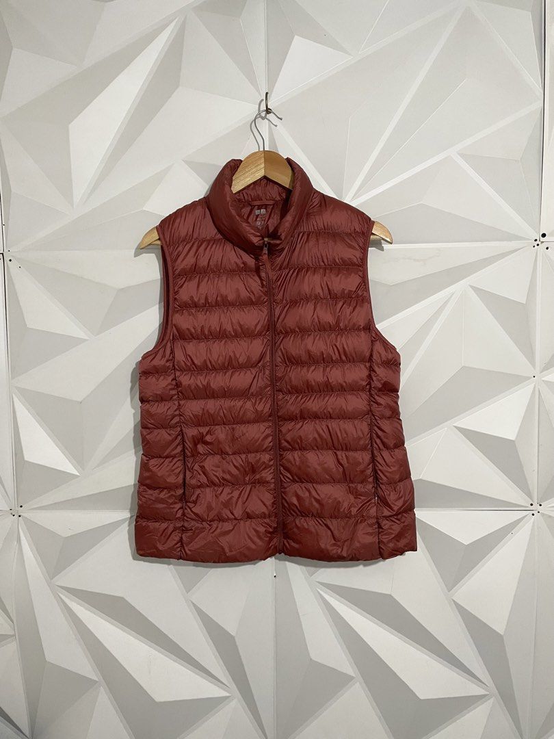 Uniqlo Ultra Light Down Vest - Red (Category: Sleeveless) located in Cabuyao City. Submitted by ParadisethriftedPh (Listing ID 1461782936, Image 1). Description: Cr: 9.8/10 Dimensions W: 20 L: 24.5 - Uniqlo Puffer Vest - Vibrant Red Color - Lightweight and Packable - Ideal for Layering - Perfect for Cooler Weather - Easy Zip-Up Design - Great for Casual Wear.