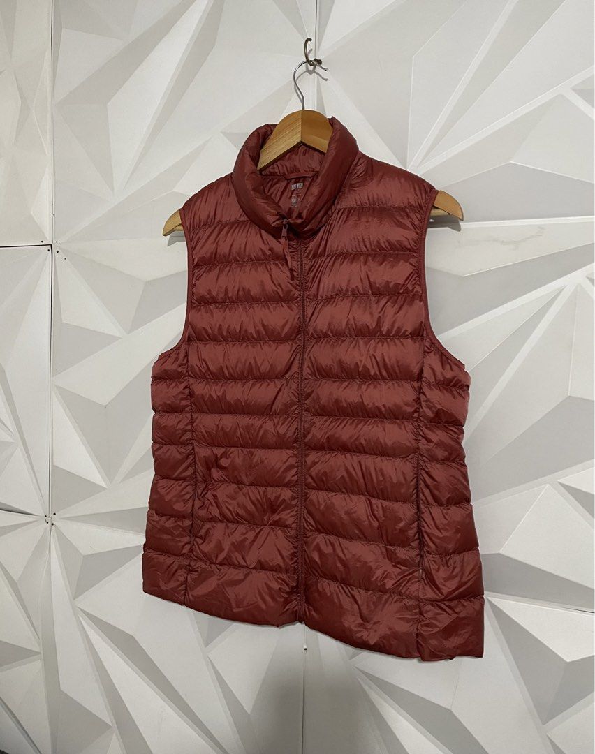 Uniqlo Ultra Light Down Vest - Red (Category: Sleeveless) located in Cabuyao City. Submitted by ParadisethriftedPh (Listing ID 1461782936, Image 2). Description: Cr: 9.8/10 Dimensions W: 20 L: 24.5 - Uniqlo Puffer Vest - Vibrant Red Color - Lightweight and Packable - Ideal for Layering - Perfect for Cooler Weather - Easy Zip-Up Design - Great for Casual Wear.