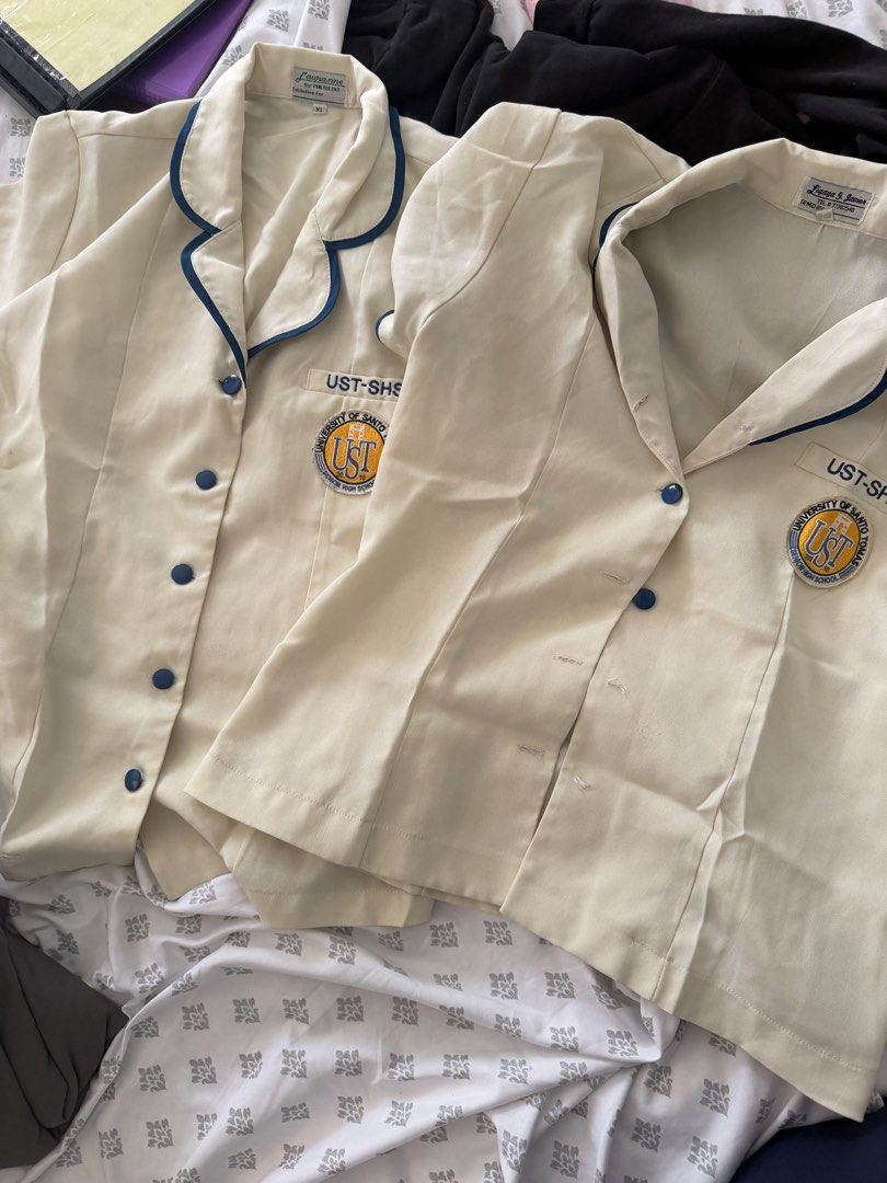UST SHS Type A Blouse (2 pcs) (Category: Coats, Jackets and Outerwear) located in Manila. Submitted by shekinahiofiel (Listing ID 1461598251, Image 2). Description: - One (1) Large and One (1) XL - XL has minor stain - large is missing 3 buttons payment through Gotyme or Bank Transfer (bdo and bpi).